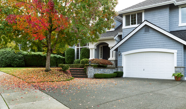This is a photo of an Abbotsford home with a sand washed driveway.
