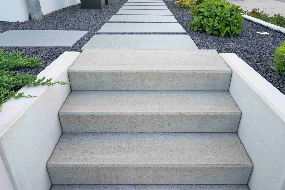 These modern style stairs were a perfect match to the exterior of this Abbotsford home. The concrete here gives a simple yet elegant look.
