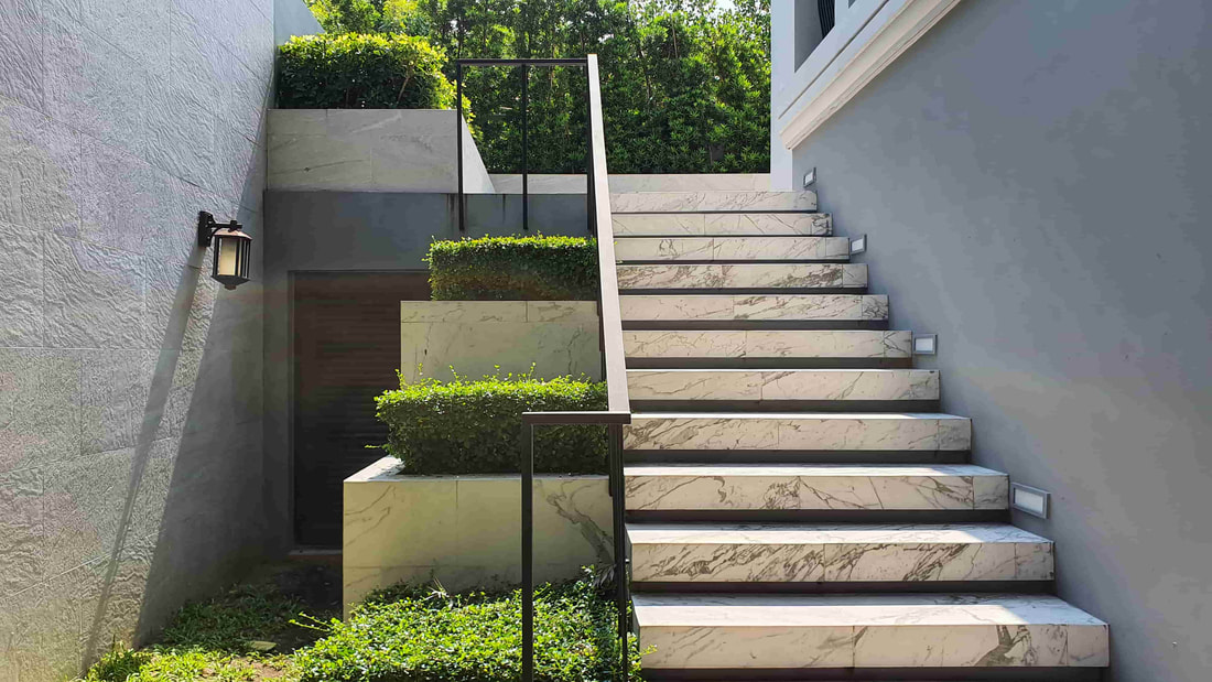 Decorative concrete used for this Abbotsford home's concrete stairs. The concrete resembles marble and matches the home's exterior perfectly.